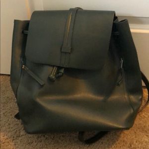 Dark green faux leather backpack